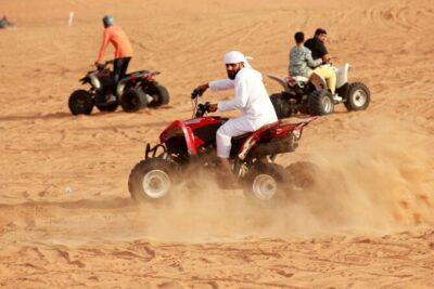 1-Hour Quad Bike Adventure: BBQ Dinner, Sandboarding & Shows! - Lahbab Dunes: Safety Briefing, Photo Stop, and Sandboarding After the Ride