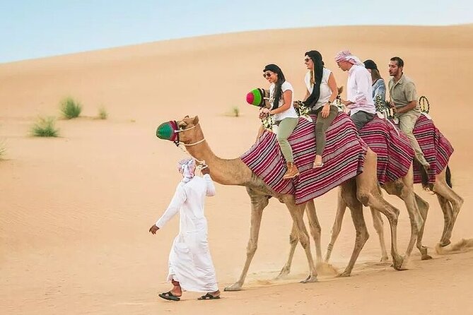 Adventurous Red Dune Desert Safari Deal with Quad Bike,Shows &BBQ - Dune bashing, camel rides, and sandboarding