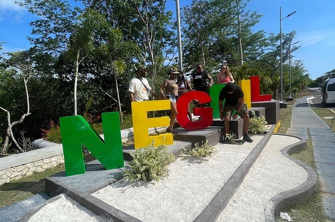 ATV, Bamboo Rafting and Negril Ricks Cafe from Montego Bay - Rick’s Café in Negril: cliff-jump show energy and sunset time