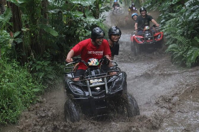 Bali ATV Quadbike Through Gorilla Face Cave - Riding scenes in Ubud: rice fields, jungle tracks, river crossings, and a tunnel