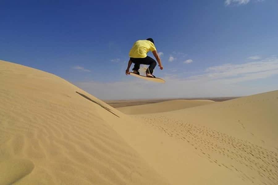 Desert Safari, Quad Bike, Camel Ride, Falcon & Sandboarding - Inland Sea (Khor al Udiad): swim time and border-region views
