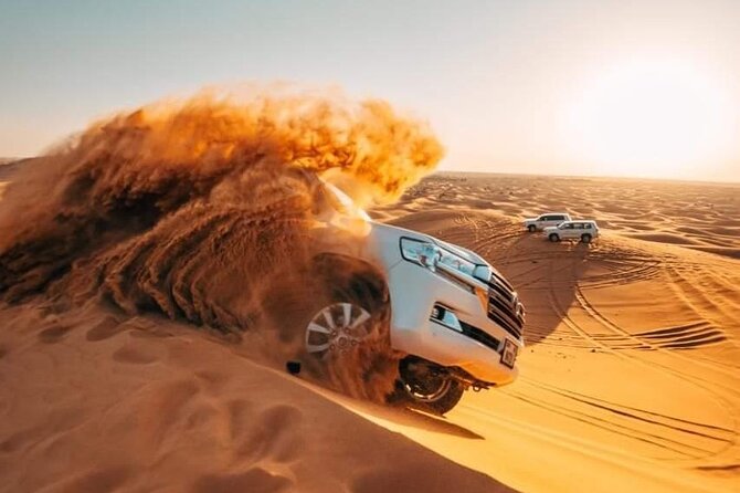 Desert Tour by ATV OR Buggy Self-drive, BBQ Dinner and Camel Ride - Stop at the red dunes: sandboarding, water breaks, and photos