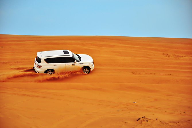 Doha: Desert Safari With Quad bike ,Camel Ride And Sand Boarding - Seamless Desert Drinks at Sealine Beach (Tea, Toilets, and Camel Time)