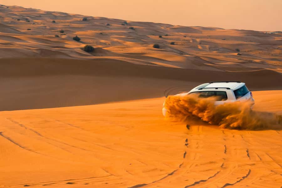 Doha: Desert Safari with Quad Bike, Sandboard & Camel Ride - Dune Bashing in a 4WD Toyota: The Big Adrenaline Moment