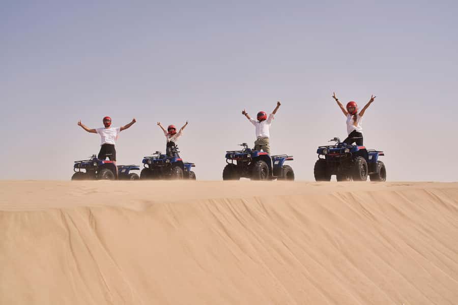 Doha: Desert Safari with Quad Bike, Sandboard & Camel Ride - Camels, Falcons, and Bedouin Host Moments