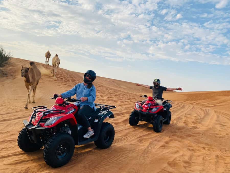 Dubai: Adventure Quad Bike Safari, Camel Ride & Refreshment - Getting Picked Up in Dubai and Reaching the Dunes