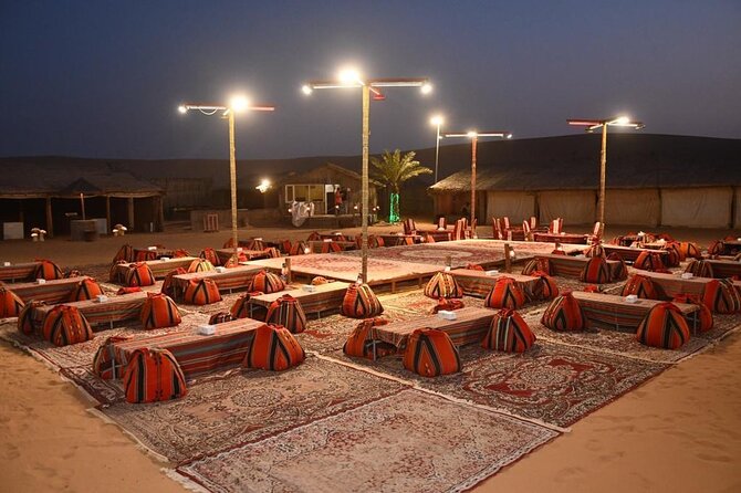 Dubai: Buggy Dune Bashing, Sand Boarding, Camel Ride & Show - Desert camp dinner and live shows: where the evening energy lands