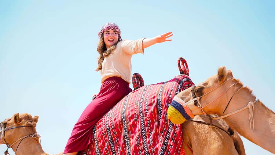 Dubai: Desert Safari, Camel Ride, Sandboarding, Quad Bike - From city traffic to desert adrenaline in a 4x4