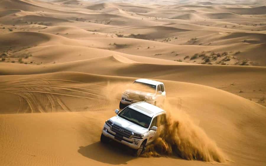 Dubai: Desert Safari, Camel Ride, Sandboarding, Quad Bike - Lahbab Desert quad bike option: fun at your own risk