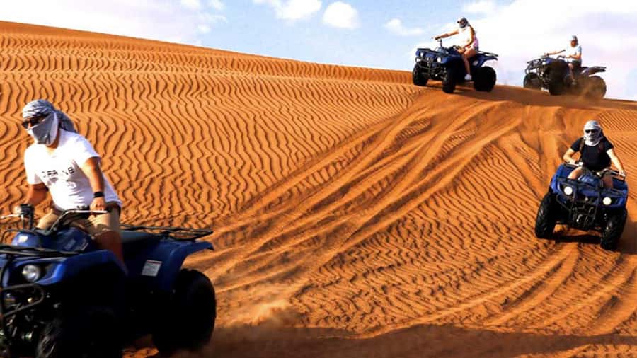 Dubai: Desert Safari, Camel Ride, Sandboarding, Quad Bike - Sandboarding at the Red Dunes: adrenaline with balance skills