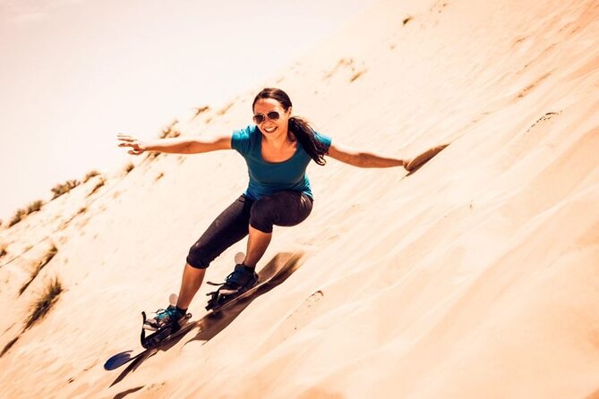 Dubai Desert Safari: Quad Bike, Camel Ride and BBQ Dinner - Dune bashing with a 4x4 Land Cruiser: fast, physical, and memorable