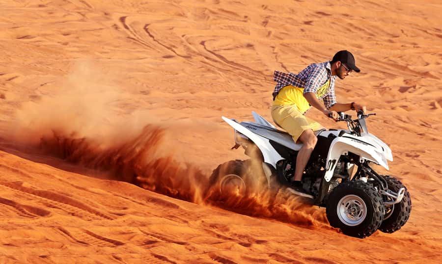 Dubai: Desert Safari, Quad Bike, Sandboarding, Camels & BBQ - Camp Arrival: Arabic Coffee, Tea, Dates, and Desert Photo Stops