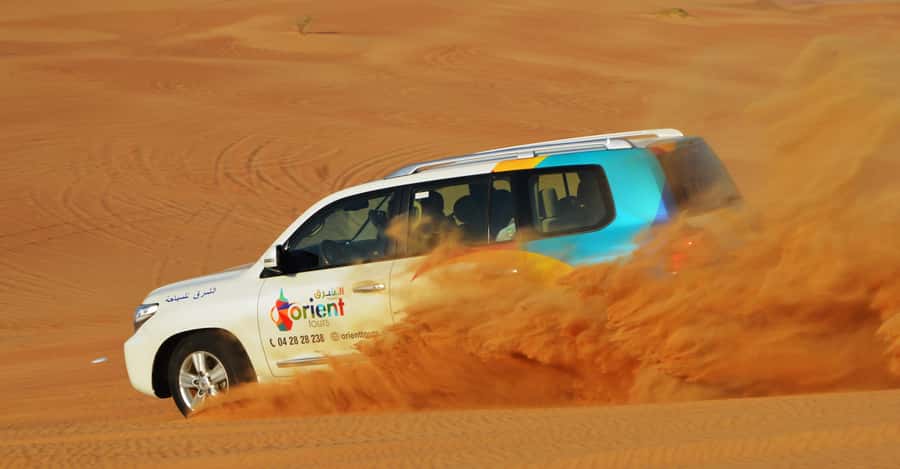 Dubai Desert Safari, Quad Biking, Camel Ride, & Sandboarding - Pickup by Land Cruiser: Where the Day Really Starts