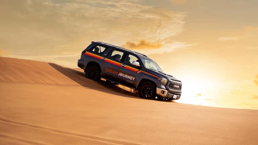 Dubai Desert Safari - Sandboarding, Quad Bike & BBQ Options - Sandboarding and Camel Rides: Easy Fun After the Adrenaline