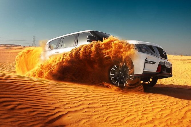 Dubai Desert Safari With BBQ, Quad Bike And Camel Ride - Entertainment at night: Tanura, belly dancing, and fire acts