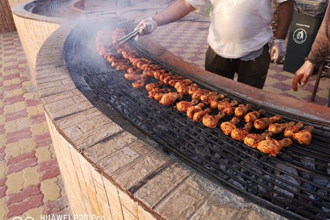 Dubai Desert Safari with Quad Bike, Camel Ride, Dinner and Shows - Camp Dinner Setup: Buffet BBQ, Unlimited Drinks, and Sheesha Time