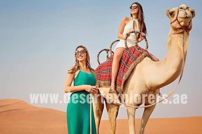 Dubai Desert Safari with Quad Bike, sandboarding, live show & BBQ - Camel ride, henna, and Arabic-style photo moments at camp