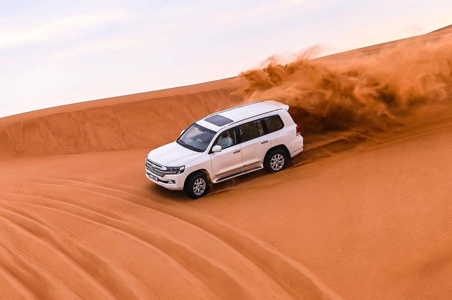 Dubai: Desert Safari with VIP BBQ and Optional Quad Bike - Dune bashing and sandboarding: the fun is physical