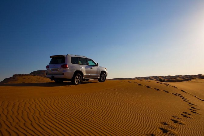 Dubai Desert Trail: Guided Quad/Polaris ATV & Red Dunes Safari - Hotel pickup to Lahbab Red Dunes: the trip that sets the mood