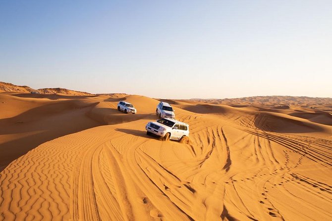 Dubai Desert Trail: Guided Quad/Polaris ATV & Red Dunes Safari - Sandboarding, camel ride, and sunset timing that actually changes the photos