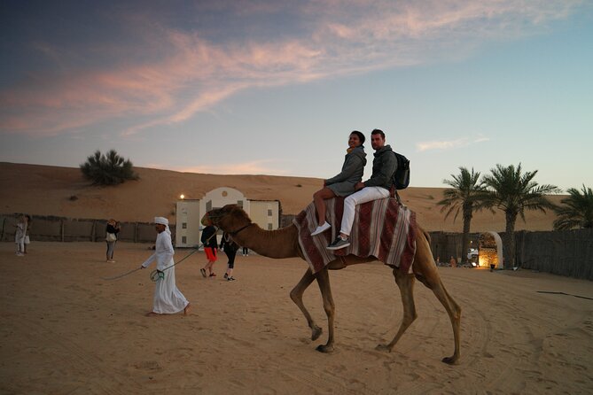 Dubai Evening Desert Safari with Thrilling Dune Buggy Adventure - Desert camp arrival: majlis seating, tea and henna moments