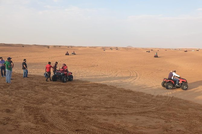 Dubai Half day Desert Safari Quad Bike & Flying Dress Photoshoot - Dune bashing and sandboarding: the adrenaline segment