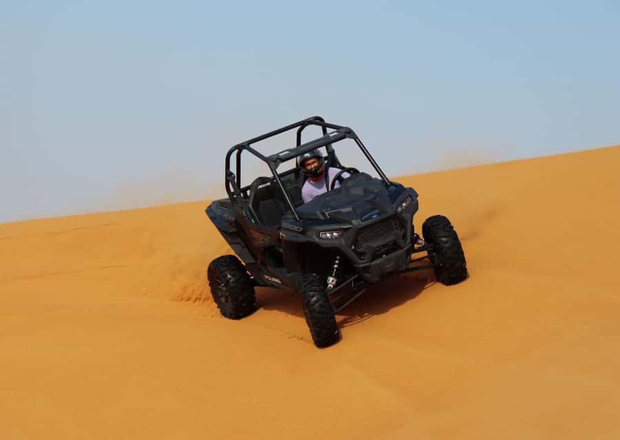 Dubai: Quad Bike, Dune Buggy, and Sandboarding Experience - Sandboarding on red dunes: the adrenaline after the engines