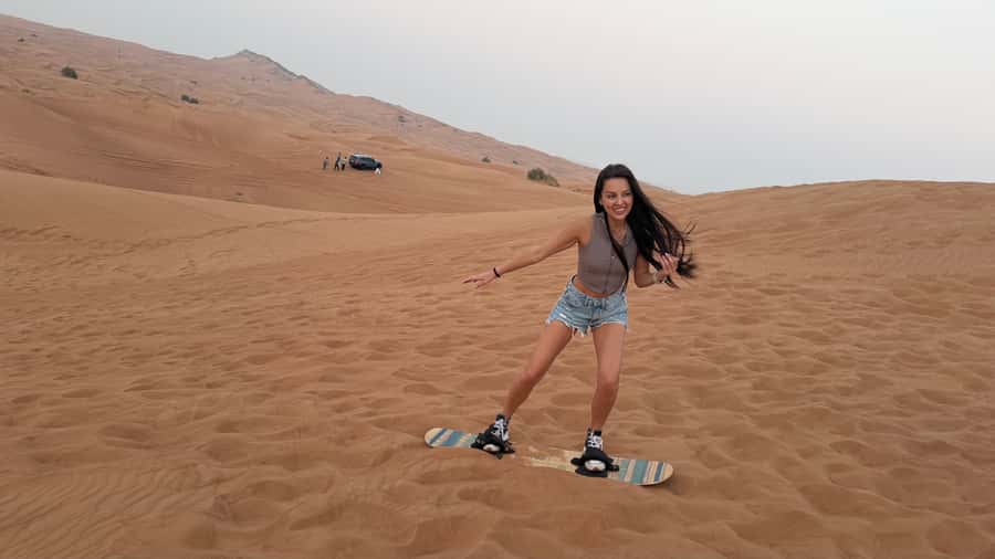 Dubai: Red Dunes Evening Quad Bike, Dune Blast with BBQ - Camel ride, falcon photo, and the desert add-ons that turn it from fun to memorable