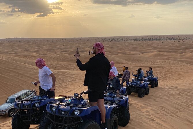 Dubai Red Dunes Quad Bike Tour,Sandboard, Camel ride & BBQ Dinner - Sandboarding: the easiest way to feel the desert’s fun side