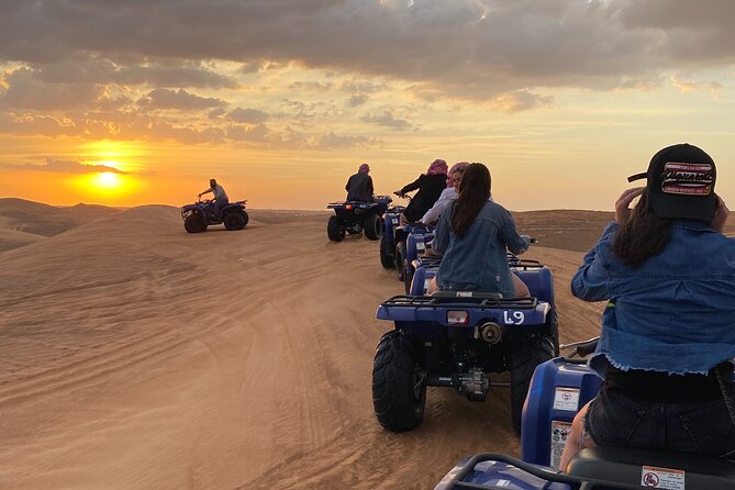 Dubai Red Dunes Quad Bike Tour,Sandboard, Camel ride & BBQ Dinner - Quad biking through the dunes for 60 minutes