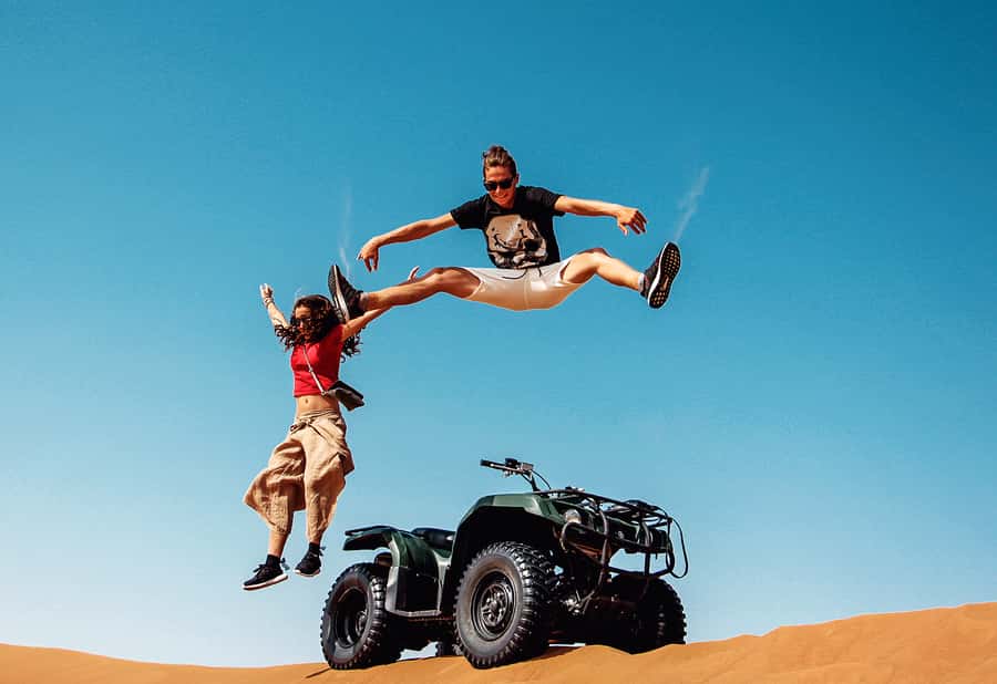 Dubai: Red Dunes Quad Bike with Sandboarding, Camels and BBQ - Desert Start: Air-Conditioned Tents and Welcome Refreshments