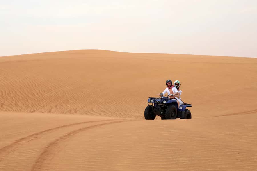 Dubai: Red Dunes Quad Bike with Sandboarding, Camels and BBQ - Al Khayma Desert Camp: Camels, Falcons, Henna, and Traditional Dress