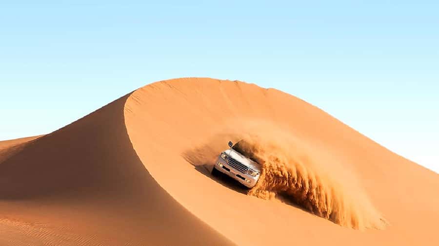 Dubai: Safari, Quad Bike, Camel Ride, and Buffet Dinner - Red Dunes dune bashing: the big adrenaline hit