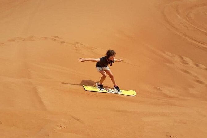 Dubai Self-drive Quad Bike, Sand Boarding, Camels & Refreshments - Sandboarding: The Fun Part After You’ve Gotten Moving