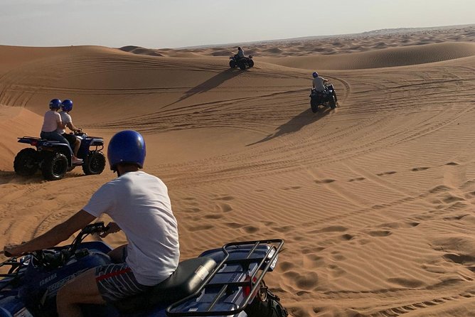 Dubai: Unique SUNSET Quad Bike Red Dunes Safari - Camel ride: the slower view you’ll appreciate later