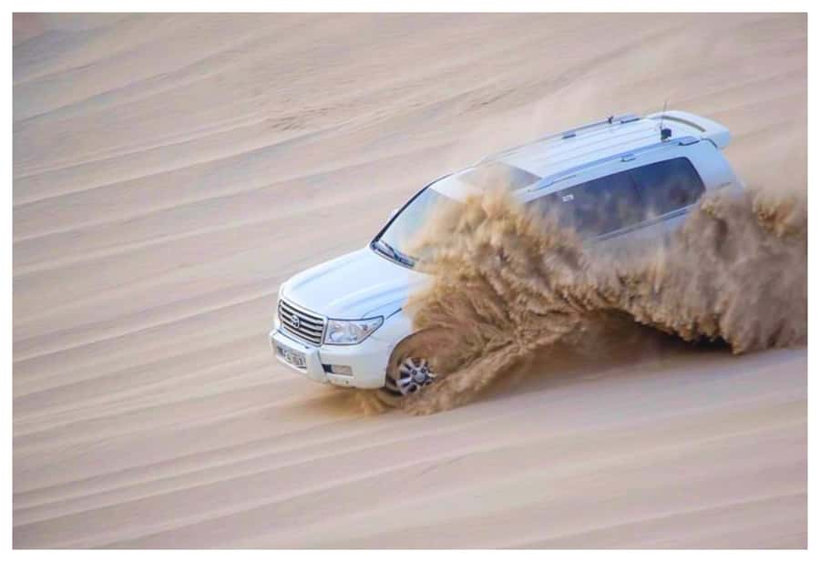 Dune Bashing, Sandboarding, Camel Ride & Optional ATV Ride - Mesaieed camel camp stop: tea, photos, and a short ride that’s actually fun