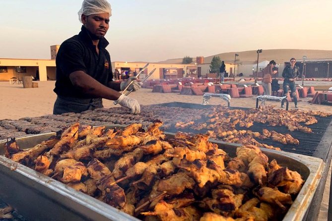 Evening Desert Safari BBQ Dinner With Quad Bike & Sand boarding - Live entertainment at night: Tanura, belly dance, fire show