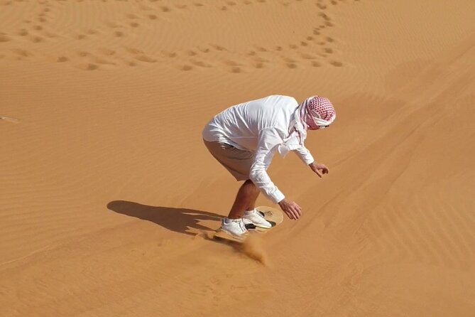 Evening Desert Safari Dubai BBQ Dinner Dune Bashing Dune Buggy - Camel ride and sandboarding: tradition meets sand sport