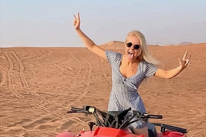 Evening Desert Safari from Dubai with Quad Bike Ride - Desert Camp Arrival: Arabic Tea, Henna, Falcon Photos, and Dress Pics