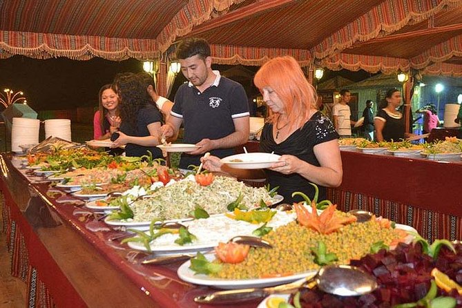 Evening Desert Safari with BBQ Dinner & self-drive Quad biking - Camel ride and sandboarding: classic desert flavor