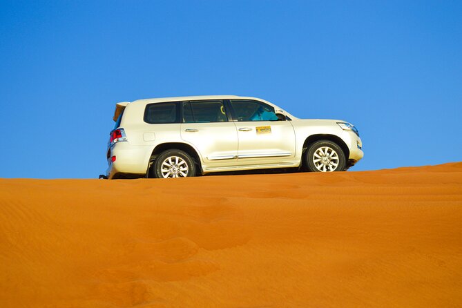 Evening Desert Safari with Quad Bike, BBQ Dinner and Camel Ride - Quad bike ATV time: where thrill meets controlled chaos