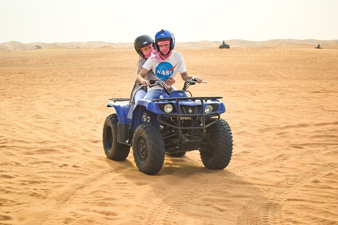 Evening Desert Safari with Quad Bike, BBQ Dinner and Camel Ride - Sunset photography break: more than a pause