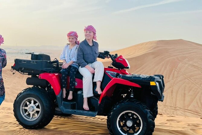 Evening Desert Safari with Quad Bike, Camel Ride & BBQ Dinner - Dune bashing on high dunes: thrill, but hold onto your seat