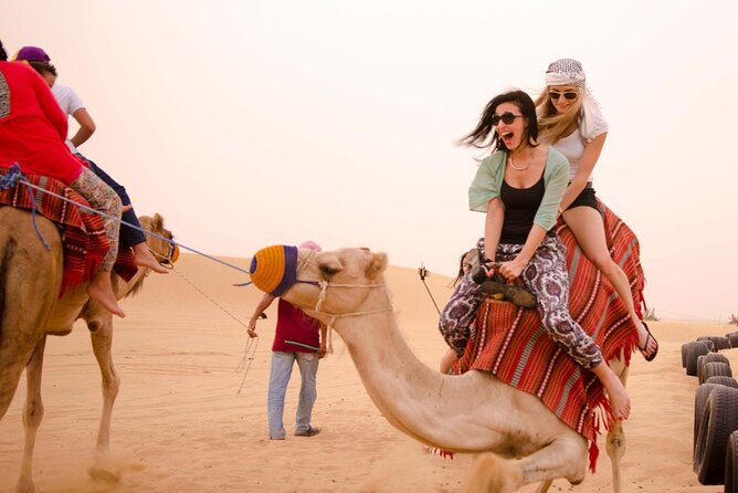 Evening Dubai Safari with BBQ, Dance Shows & Quad Biking optional - Bedouin camp welcome: coffee, dates, shisha, and real show energy