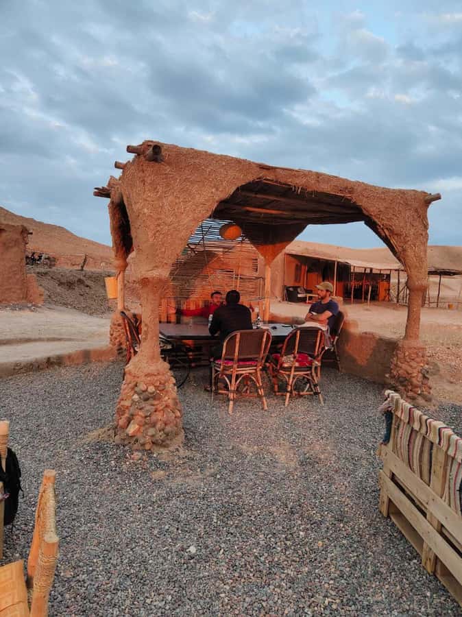From Marrakech: Camel, Quad Bike Tour, Sunset, Dinner & Show - Dinner Under Berber Tents: Tajine, Harira, and Pastries