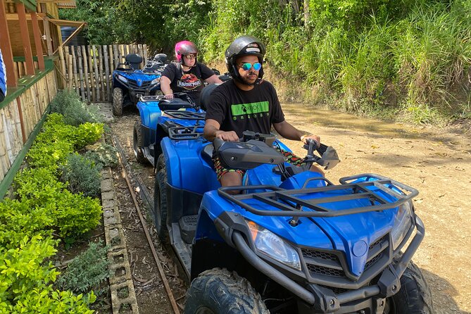 Full Day ATV Bush Trail and Water Sports Tour with Rick's Cafe - Green Island ATV bush trail: muddy fun with real prep