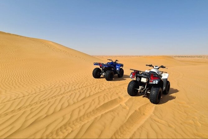 Guided Desert Safari with Dinner and Quad Biking in Dubai - First Stop: Lahbab Desert Drive for Big Sunset Energy