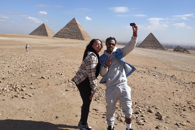 Guided Tour of Giza Pyramids&Sphinx&Camel Ride&ATV bike &Lunch - Stop 1: Giza Pyramids (Great Pyramid of Khufu) for about an hour