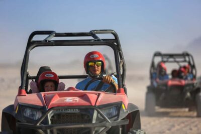 Hurghada: Sunset Desert Safari by Dune Buggy - Getting out of Hurghada: pickup, AC comfort, and village pass-bys