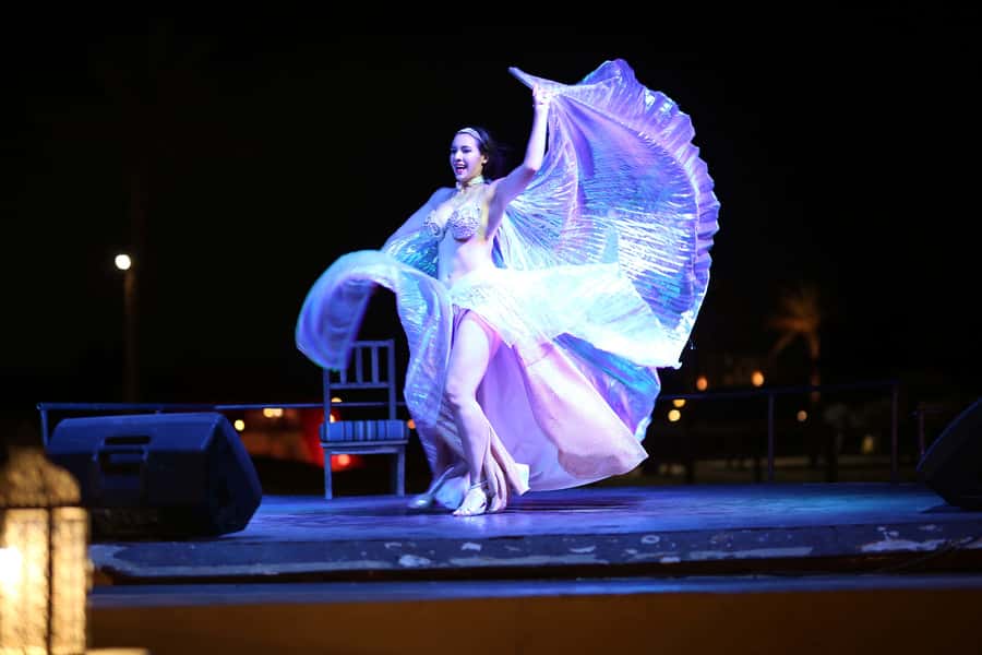Luxury Dubai Desert Safari, BBQ, Camel Ride, Quad Bike, Show - The show lineup: Tanoura, belly dancing, Dabke, Saidi, and fire
